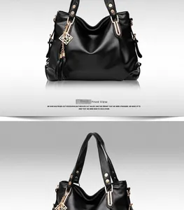 Detail of black pebbled faux leather tote featuring golden hardware and tassel charm