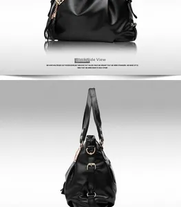 Detail view of black faux leather tote featuring gold hardware and stylish tassel charm