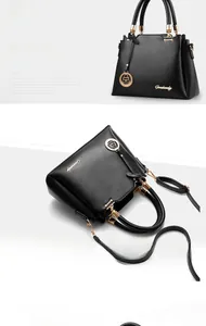 Macro shot of black pebbled leather bucket bag featuring gold hardware and logo detail