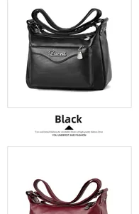 Close-up of soft leather handbags in black and burgundy with multiple zipper compartments