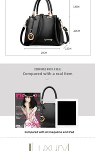 Detailed view of black leather tote bag with gold ring buckle and Genisandy logo charm
