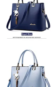Detail of royal blue and light blue faux leather handbags with gold Aimily metal logo