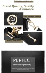 Detail of black PU leather bucket bag with gold metal hooks and round logo charms