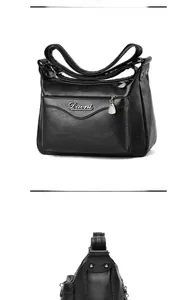 Detailed macro view of black lychee texture faux leather with multi-layer metal zippers