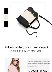 Detail view of contrast color handbag with lychee texture and stylish tassel decoration
