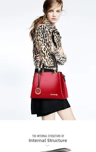 Detail of the internal structure and leather texture of this red fashion bucket handbag