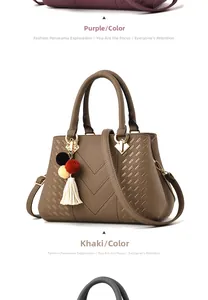 Detail der khakifarbenen Lederhandtasche mit V-Naht und farbenfrohem Quastenanhänger