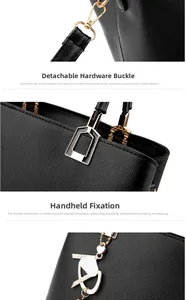 Close-up of durable golden metal clasps and heart charm on black pebbled leather handbag