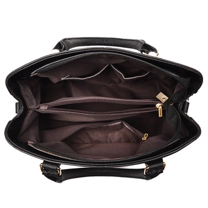 Black leather handbag with spacious interior compartments and golden hardware details