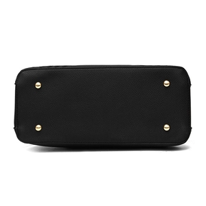 Bottom view of black pebble leather handbag featuring four protective gold metal feet