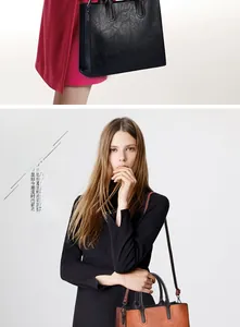 Detail of lychee textured leather tote with round handles and detachable strap