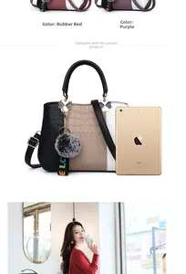 Detail of stone-patterned handbag featuring contrast colors, plush charm and strap