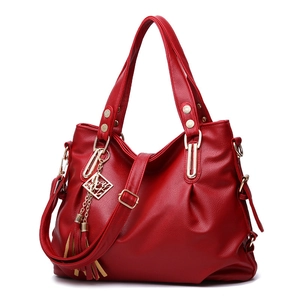 Red large capacity soft leather handbag with gold hardware and tassel detail for women