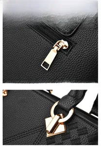 Detailansicht der schwarzen Handtasche mit Lychee-Prägung und goldenen Reißverschlüssen