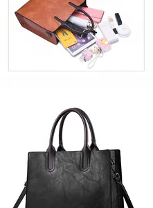 Macro view of large retro tote bag capacity showing tablet, wallet, and cosmetics storage