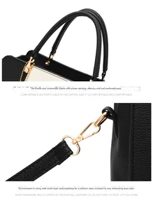 Detail of lychee pattern leather contrast handbag with gold plated hardware and stitching