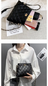 Detailed view of black quilted chain bag showing spacious interior for essentials