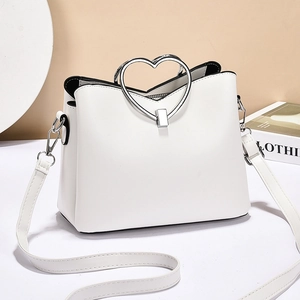 White structured heart-handle PU handbag with silver hardware and shoulder strap