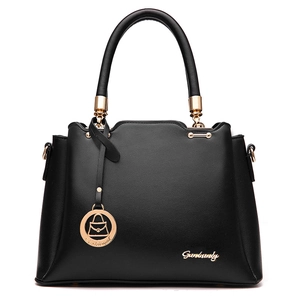 Minimalist black leather bucket bag with top handle and gold hardware in a front view