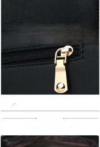 Detail of gold metal rivets on bottom and smooth zipper on black stone pattern handbag