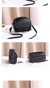 Détail du sac bandoulière noir en cuir grainé avec trois zips et coutures blanches