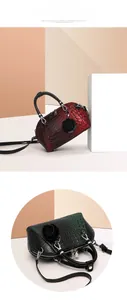 Detail of crocodile pattern shell handbag with 3D rose charm and gradient finish