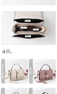 Internal structure of small crossbody bag showing main compartment and zippered pocket