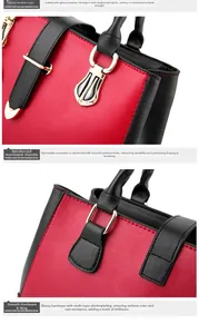 Close-up of golden metal hardware and reinforced handle on red and black leather handbag
