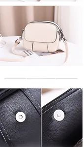 Détail du cuir à motif litchi, boucle magnétique argentée et fermetures éclair du sac