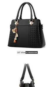 Detail of black tote bag featuring lychee texture, woven pattern and flower tassel charm