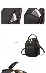Detail view of mini black leather backpack featuring gold zippers and anti-theft back pocket