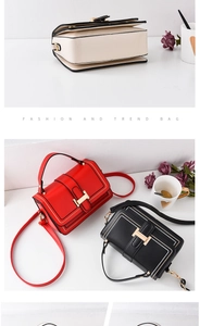 Detail view of stylish square crossbody bags in cream, red, and black with H-shaped metal clasp