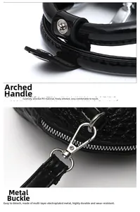 Detail of black crocodile texture bag featuring arched handle and silver metal buckle
