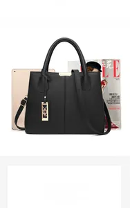 Black pebbled leather tote bag size comparison with A4 magazine and 9.7-inch tablet