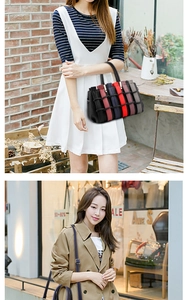 Detail of multi-color woven tote and navy leather crossbody bag with top handle