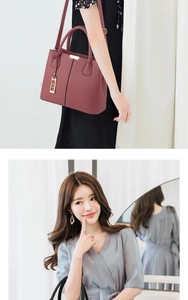Detailed view of a dark burgundy pebble grain handbag and an elegant light blue V-neck dress