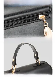 Detail of ergonomic handle and anti-oxidation gold plated zipper on black leather handbag