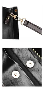 Detail of high-quality black leather texture with white stitching and gold hardware clips