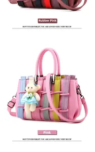 Detail of pink pebbled leather handbag featuring multi-colored woven vertical straps and bear charm