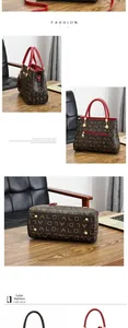 Vue détaillée du sac monogramme avec poignées rouges et pieds de protection en métal