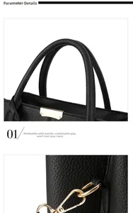 Close-up of black litchi grain leather handle and light gold metal hardware on handbag