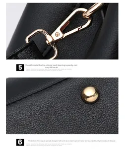Detail of black pebbled leather texture with gold metal buckles and protective bottom studs