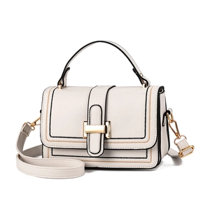Chic beige crossbody square bag with gold H-buckle and contrasting black edge finish
