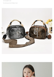Detail of snake skin pattern leather handbag with silk scarf handle and tassel charm