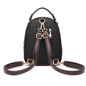 Mini black pebbled leather backpack for women with brown straps and gold hardware