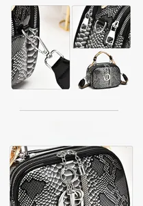 Close-up of snake pattern leather texture, silver metal hardware, and silk handle wrap
