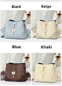 Detail of woven bucket bags in four colors with bow charms and jacquard straps