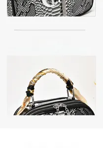 Detail of python skin texture hand bag with silk scarf handle and silver metal zipper