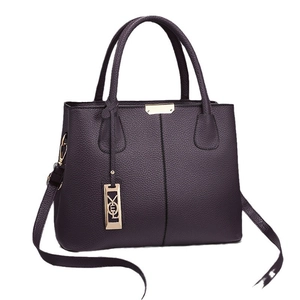 Deep purple lychee grain leather tote bag with gold logo pendant and top handles