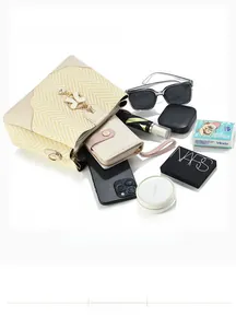 Top view of beige woven bucket bag showing large capacity for phone, wallet and cosmetics